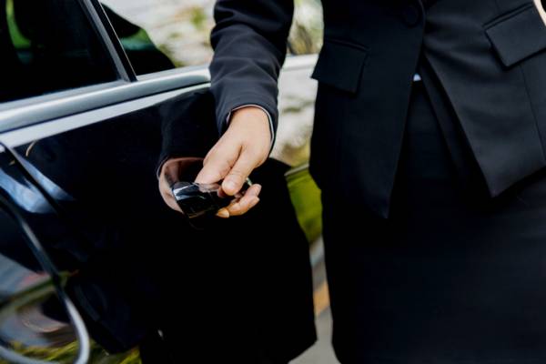 A man opens a car door A man opens a car door