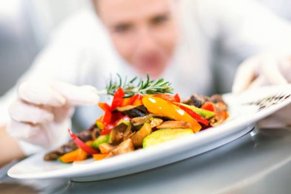 A chef plates a dish A chef plates a dish